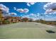 Private lighted tennis court with basketball hoop at 24546 N 91St St, Scottsdale, AZ 85255
