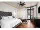 Charming bedroom with a queen-size bed and access to a private patio at 24546 N 91St St, Scottsdale, AZ 85255
