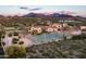 Aerial view of home, pool, tennis court, and mountain views at 24546 N 91St St, Scottsdale, AZ 85255