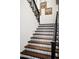 Elegant staircase with a unique patterned tile and dark wood at 24546 N 91St St, Scottsdale, AZ 85255
