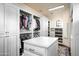 Large walk-in closet with ample shelving and hanging space at 24546 N 91St St, Scottsdale, AZ 85255