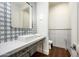 Modern powder room with patterned tile and a floating vanity at 24546 N 91St St, Scottsdale, AZ 85255