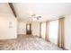 Bright living room with wood-look flooring and ceiling fan at 9302 E Broadway Rd # 1, Mesa, AZ 85208