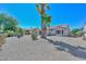 Spacious backyard with gravel landscaping and desert plants at 15574 W Vista Grande Ln, Surprise, AZ 85374