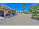 Covered patio with seating area, grill, and desert landscaping at 15574 W Vista Grande Ln, Surprise, AZ 85374