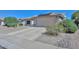 House exterior with desert landscaping and driveway at 15574 W Vista Grande Ln, Surprise, AZ 85374