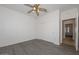 Bright bedroom with double door closet and wood-look floors at 15574 W Vista Grande Ln, Surprise, AZ 85374