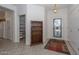 Entryway with a bookcase and access to pantry at 15574 W Vista Grande Ln, Surprise, AZ 85374