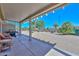 Spacious covered patio overlooking a desert landscape at 15574 W Vista Grande Ln, Surprise, AZ 85374