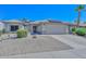 Single story home with solar panels and a two-car garage at 15574 W Vista Grande Ln, Surprise, AZ 85374