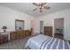 Spacious bedroom with large dresser, walk-in closet, and ensuite bathroom at 15574 W Vista Grande Ln, Surprise, AZ 85374