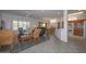 Open concept living room and kitchen with tile flooring at 15574 W Vista Grande Ln, Surprise, AZ 85374