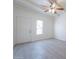 Bright living room with gray tile floors and ceiling fan at 1331 E Pierson St, Phoenix, AZ 85014