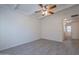 Bright living room with gray tile floors and ceiling fan at 1331 E Pierson St, Phoenix, AZ 85014