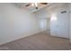 Bedroom with neutral carpet, mirrored closet doors, and ceiling fan at 1331 E Pierson St, Phoenix, AZ 85014