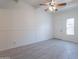 Bright living room with gray tile floors and ceiling fan at 1331 E Pierson St, Phoenix, AZ 85014