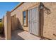 Tan stucco building with a security door and walkway at 1331 E Pierson St, Phoenix, AZ 85014