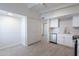 Updated kitchen with white cabinets, stainless steel dishwasher, and gray tile floors at 1331 E Pierson St, Phoenix, AZ 85014