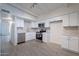 Bright kitchen features white cabinets, stainless steel appliances, and modern tile flooring at 1331 E Pierson St, Phoenix, AZ 85014