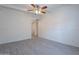 Bright living room with gray tile floors and ceiling fan at 1331 E Pierson St, Phoenix, AZ 85014