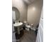 Clean bathroom with pedestal sink and toilet at 2114 S 241St Ave, Buckeye, AZ 85326