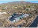 Aerial view of a house under construction, showcasing its modern design and expansive desert lot at 40575 N 109Th Pl, Scottsdale, AZ 85262