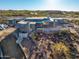 Aerial view of a stunning modern home under construction in a desert landscape at 40575 N 109Th Pl, Scottsdale, AZ 85262
