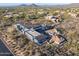 Aerial view of a new modern home under construction in a scenic desert location at 40575 N 109Th Pl, Scottsdale, AZ 85262