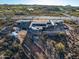 Aerial view of a large, modern home under construction in a desert setting at 40575 N 109Th Pl, Scottsdale, AZ 85262