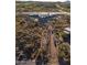 Aerial view of a home under construction with a long driveway at 40575 N 109Th Pl, Scottsdale, AZ 85262