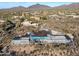 Aerial view of a modern house under construction, situated on a hillside at 40575 N 109Th Pl, Scottsdale, AZ 85262