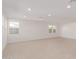 Open living room featuring tile floors and recessed lighting at 21354 E Sparrow Dr, Queen Creek, AZ 85142