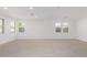 Bright and airy living room with tile flooring and multiple windows at 21354 E Sparrow Dr, Queen Creek, AZ 85142