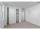 Well-lit bedroom with closet and carpeted floor at 21354 E Sparrow Dr, Queen Creek, AZ 85142