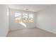 Bright bedroom with neutral carpeting and large windows at 21354 E Sparrow Dr, Queen Creek, AZ 85142