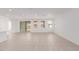 Living room with access to backyard and neutral tile floors at 21354 E Sparrow Dr, Queen Creek, AZ 85142