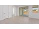 Bedroom with sliding door to backyard and neutral tile floors at 21354 E Sparrow Dr, Queen Creek, AZ 85142
