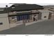 Back exterior view of a luxury home with stone accents and large windows at 40575 N 109Th Pl, Scottsdale, AZ 85262