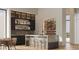 Elegant wet bar with wine storage and modern finishes at 40575 N 109Th Pl, Scottsdale, AZ 85262