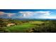 Stunning aerial view of a golf course and mountain landscape at 40575 N 109Th Pl, Scottsdale, AZ 85262