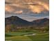 Aerial view of a community showcasing a golf course and desert landscape at 40575 N 109Th Pl, Scottsdale, AZ 85262