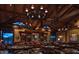 Elegant clubhouse bar with a high ceiling, chandelier, and comfortable seating at 40575 N 109Th Pl, Scottsdale, AZ 85262