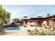 Luxury home with inviting pool, expansive patio, and desert landscape at 40575 N 109Th Pl, Scottsdale, AZ 85262