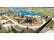 Modern playground with shade structures at 12253 E Aster Ln, Florence, AZ 85132