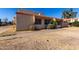 View of the house's side, showing the stucco exterior and landscaping at , Glendale, AZ 85301