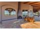 Relaxing patio with a fireplace and built-in seating at 13330 E Jomax Rd, Scottsdale, AZ 85262