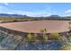 Riding arena with stone border and mountain backdrop at 13330 E Jomax Rd, Scottsdale, AZ 85262