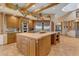 Island kitchen with stainless steel appliances and custom wood cabinets at 13330 E Jomax Rd, Scottsdale, AZ 85262