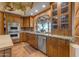 Kitchen with granite countertops, stainless steel appliances, and wood cabinets at 13330 E Jomax Rd, Scottsdale, AZ 85262