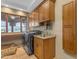 Spacious laundry room with ample cabinetry and sink at 13330 E Jomax Rd, Scottsdale, AZ 85262